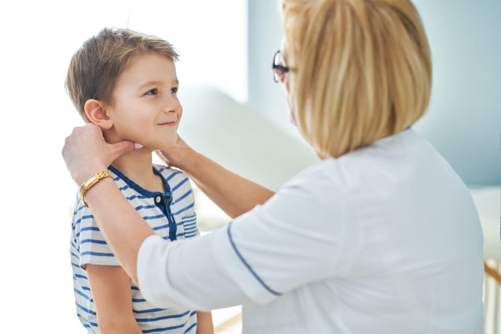 Specialist examining a child's hearing